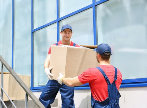 Removal team loading household furniture for a local move in Togermany