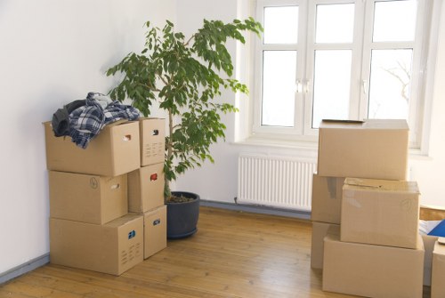 Local movers navigating a narrow street and residential access