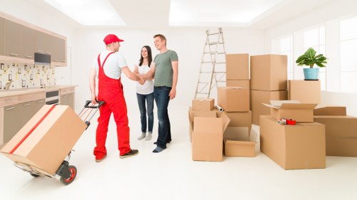 Local customers loading furniture into a removal truck