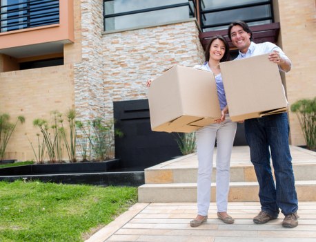 Professional removal service with furniture and packed boxes